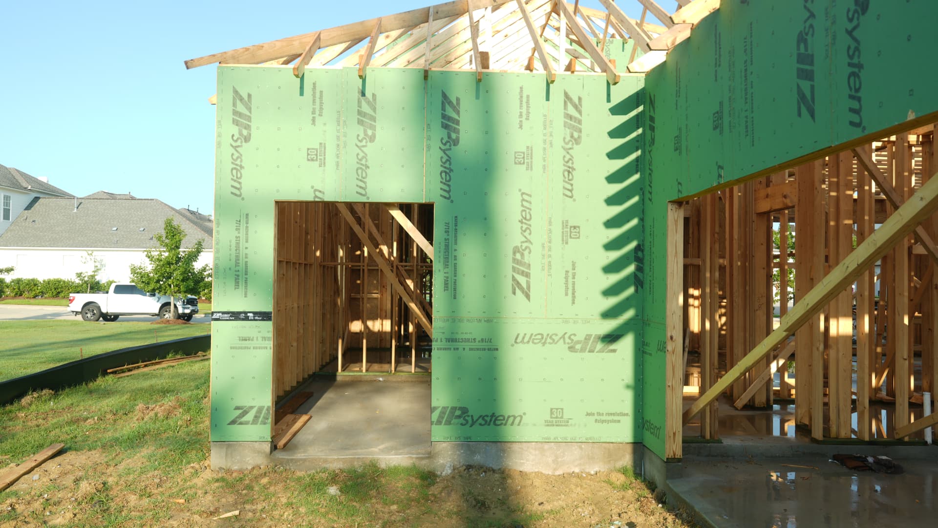 Framing and sheathing taking shape at the covered entry.