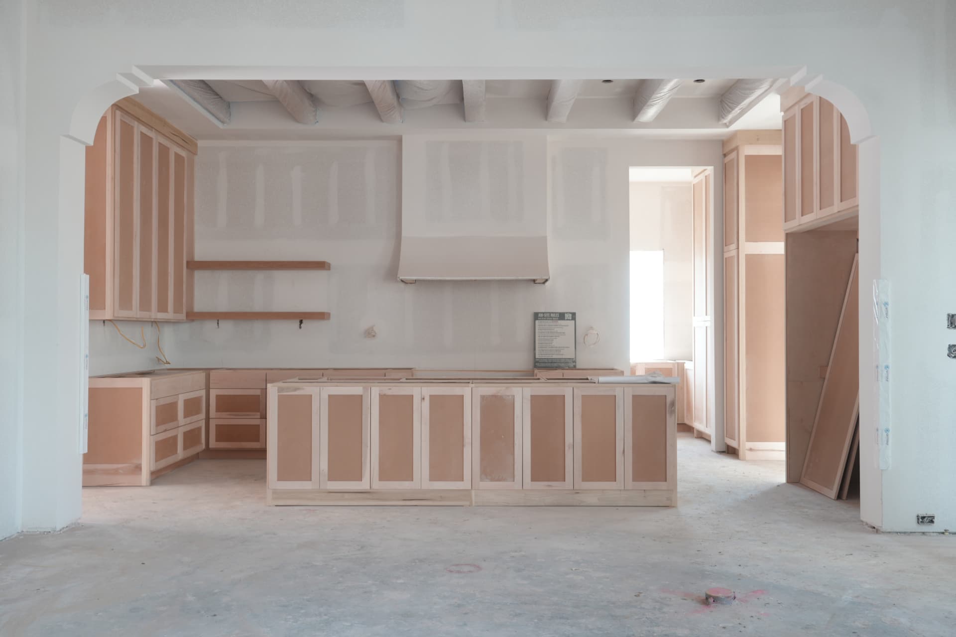 Cabinet installation in the kitchen ahead of countertops and finishes.